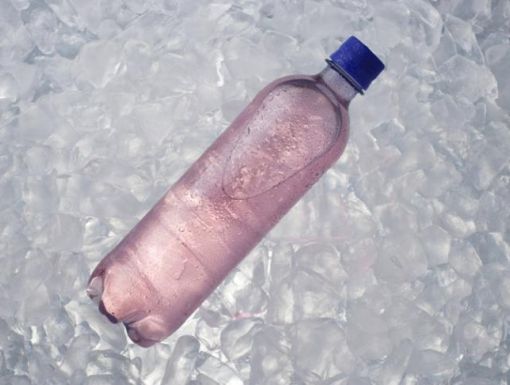 Purple electrolyte drink in a plastic bottle