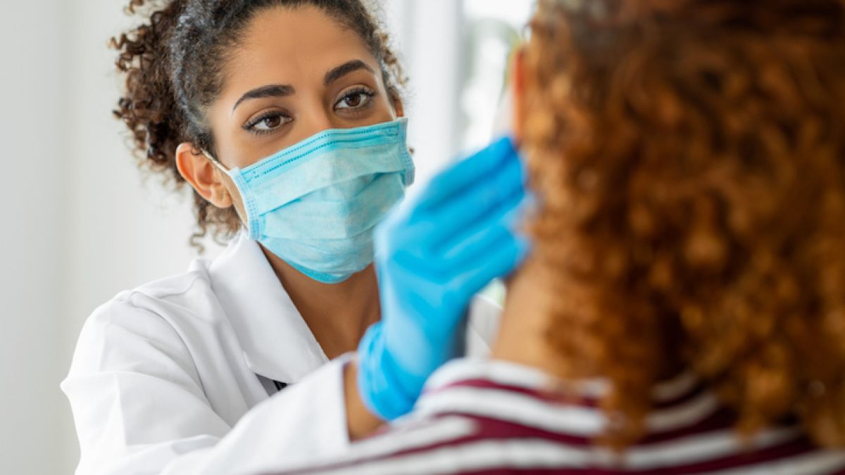Physician examining patient monkeypox