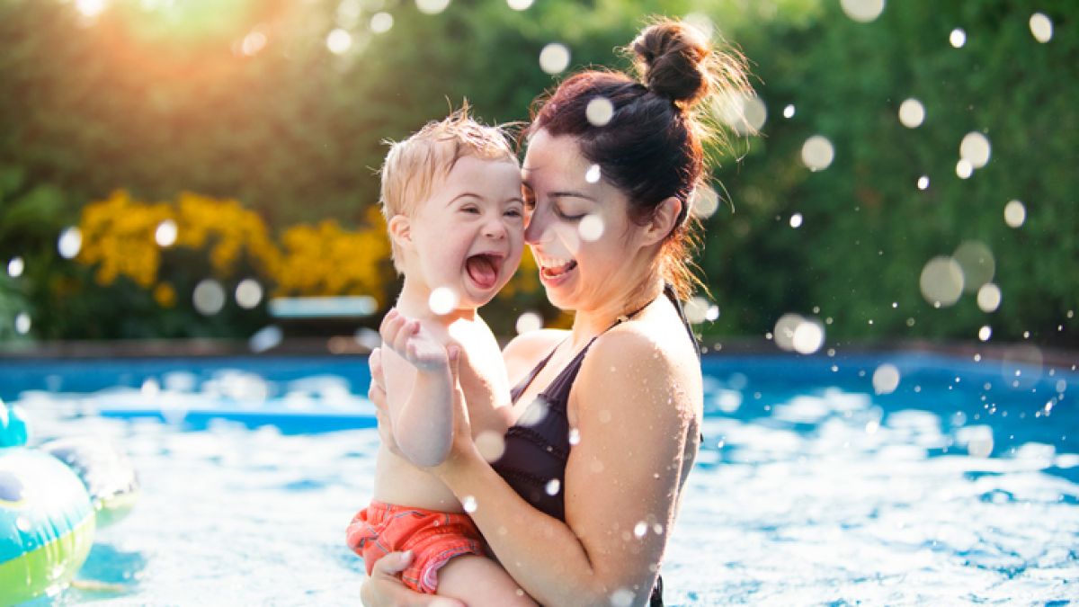 Child and mom swimming
