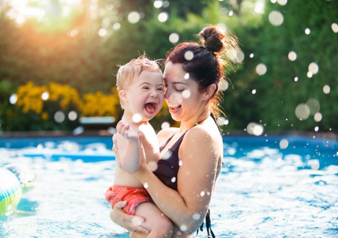 Child and mom swimming