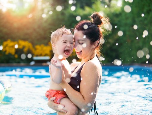 Child and mom swimming