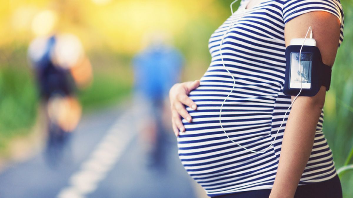 Pregnant woman walking outside