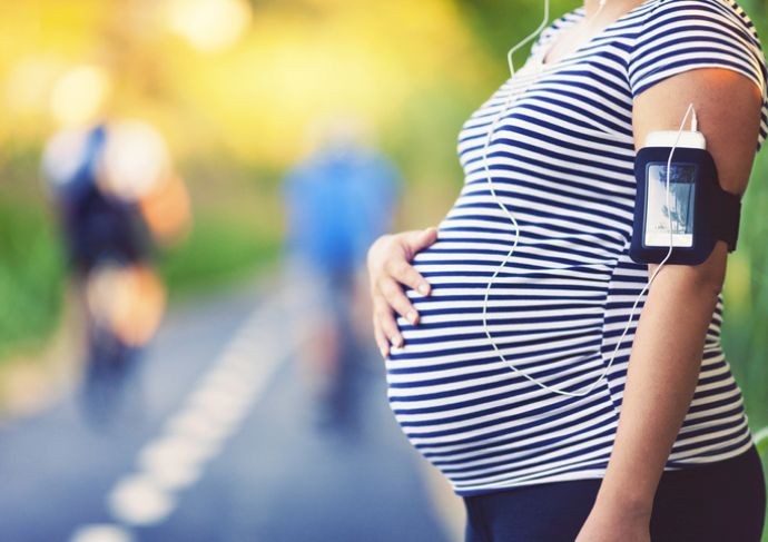Pregnant woman walking outside