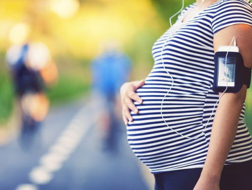 Pregnant woman walking outside