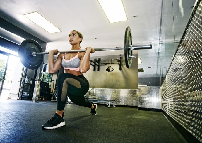 Woman doing lunges with weight push day workout
