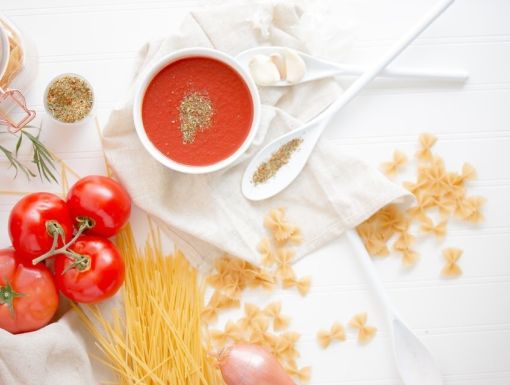 Homemade pasta sauce ingredients displaying on a table
