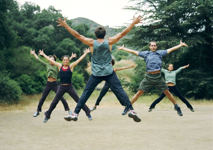 Group of people exercising and jumping outside