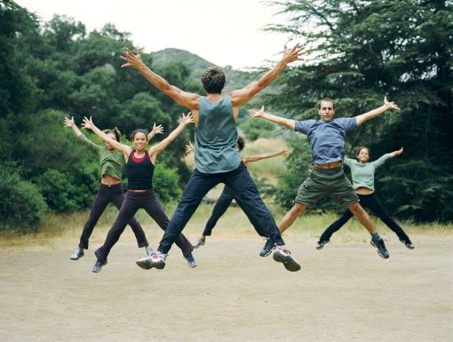 Group of people exercising and jumping outside
