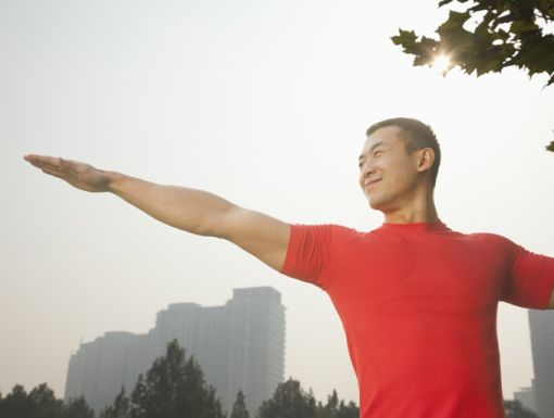 Thinkstockphotos 184565078 Muscular Man Stretching In Park