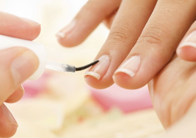 Woman painting her nails