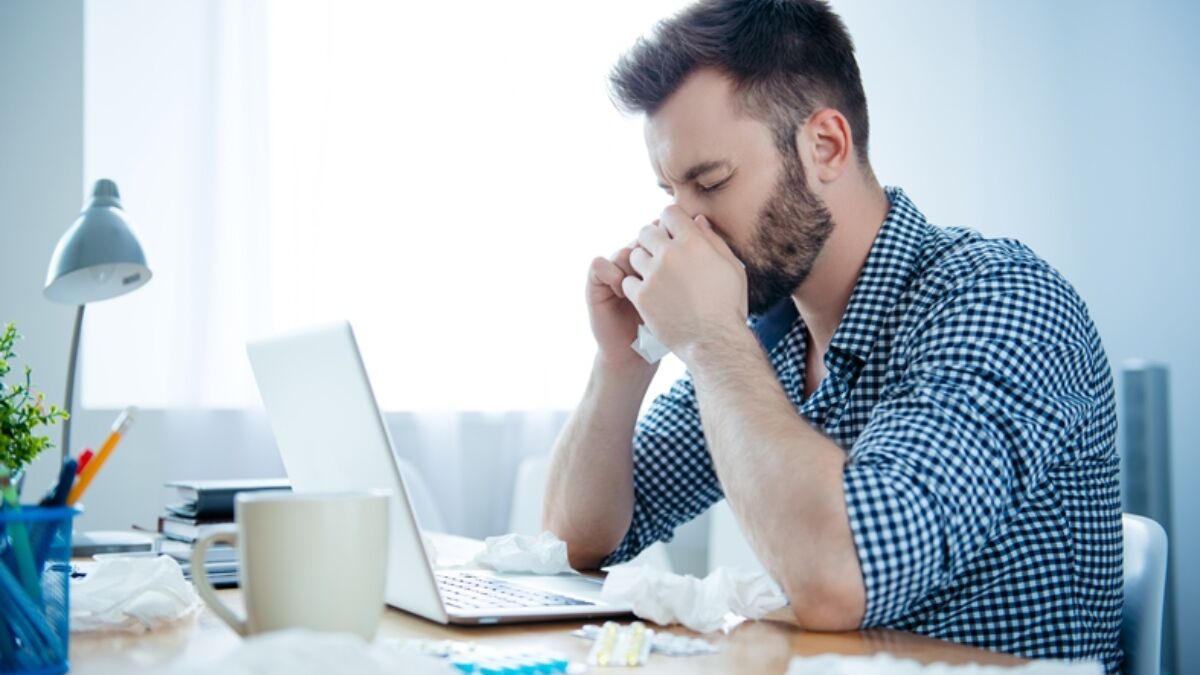 Man blowing nose in toiletpaper