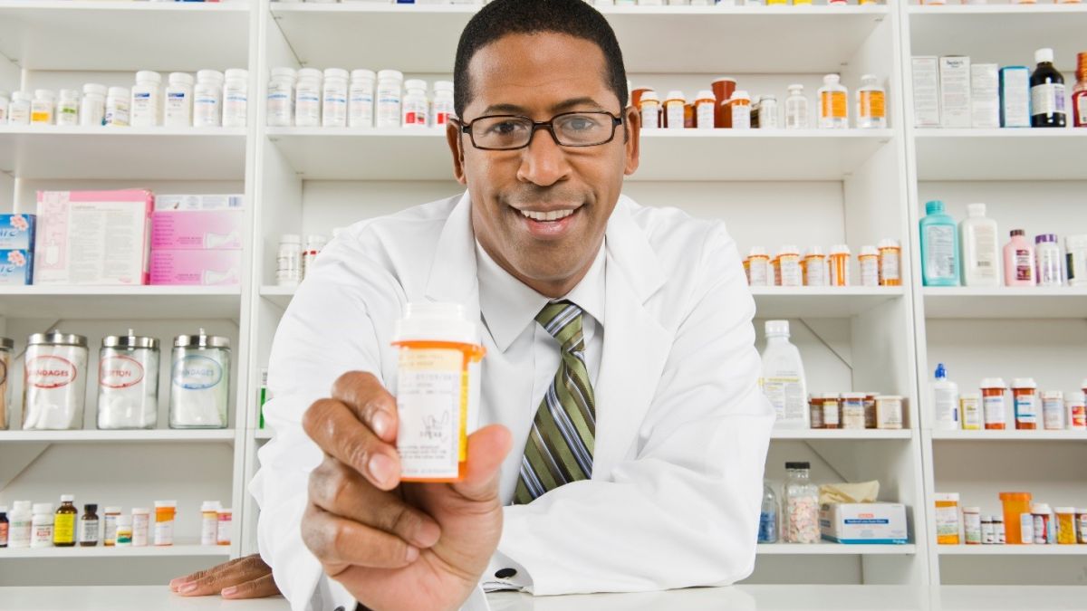a pharmacist with a pill bottle