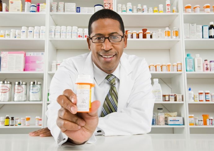 a pharmacist with a pill bottle