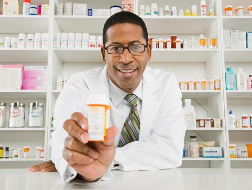 a pharmacist with a pill bottle