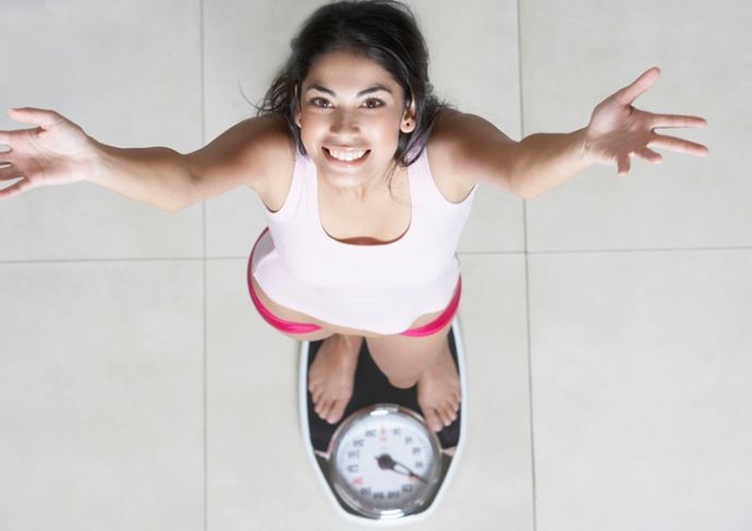 Thinkstockphotos 78618313 Woman Weighing Herself