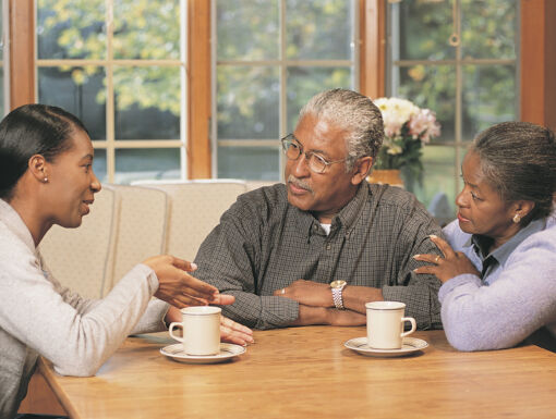 older couple talking to their daughter
