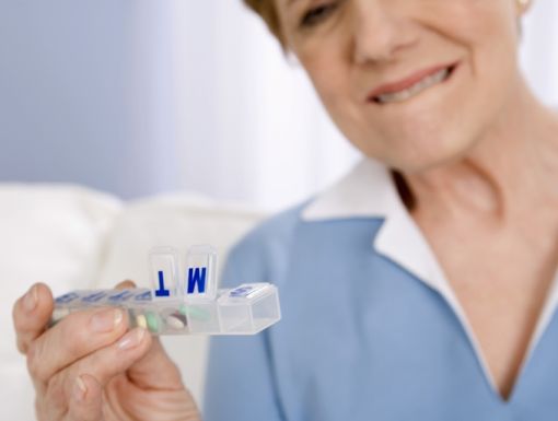 Thinkstockphotos 80616890 Woman With Pill Dispenser