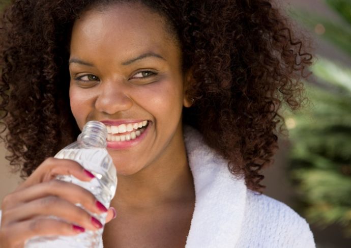 Woman Holding Water Bottle while outside