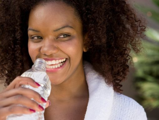 Woman Holding Water Bottle while outside