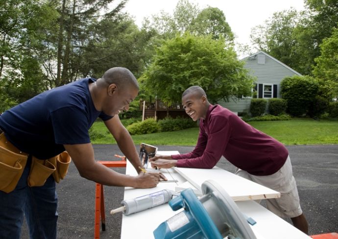 Thinkstockphotos 83590756 Father And Son Working On House