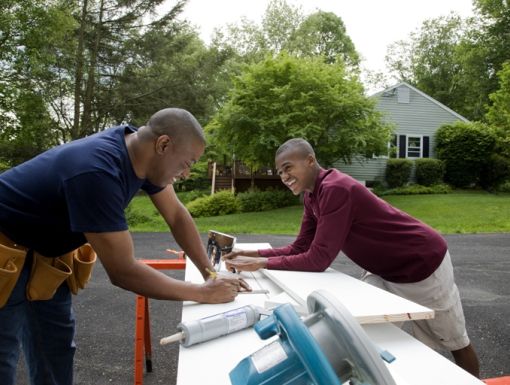 Thinkstockphotos 83590756 Father And Son Working On House