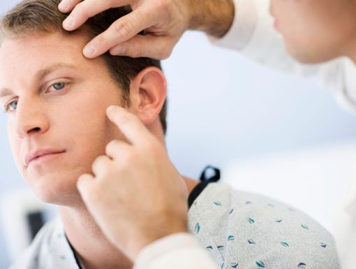 Thinkstockphotos 83405689 Doctor Examining Man