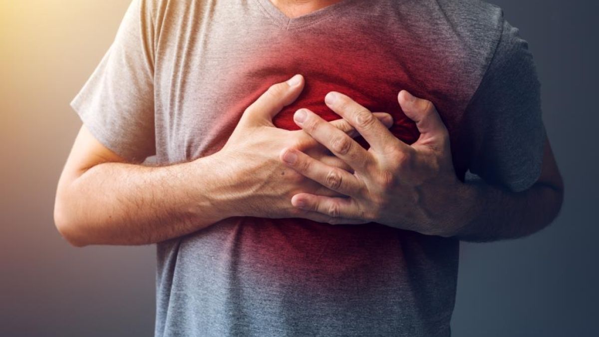 Patient holding hand on chest near heart