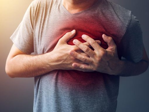 Patient holding hand on chest near heart