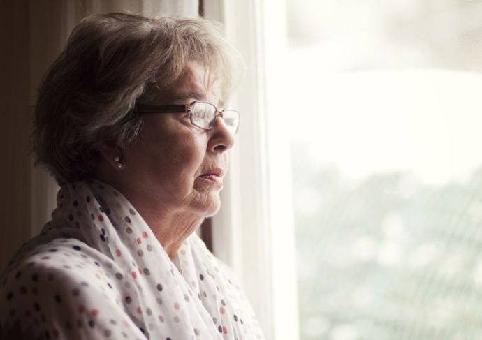 Thinkstockphotos 496352559 Senior Woman Looking Out Window