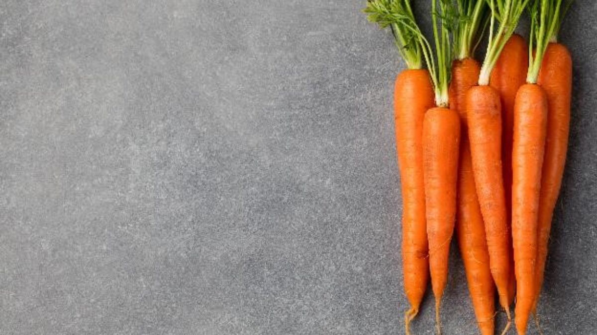 A bunch of carrots on a table top
