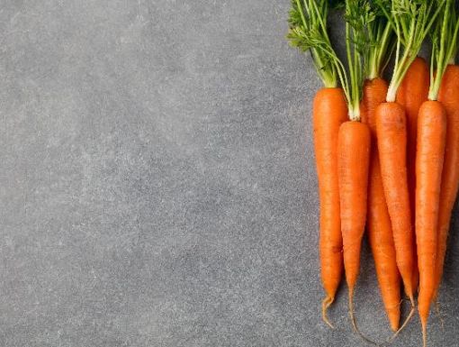 A bunch of carrots on a table top