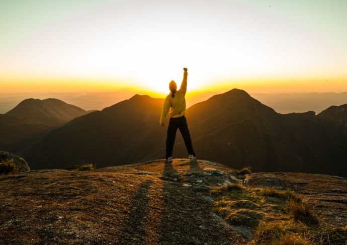 Thinkstockphotos 515369338 Man On Top Of A Mountain