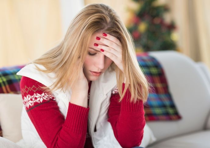 Thinkstockphotos 525952857 Sad Woman Sitting On Living Room Couch