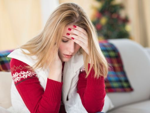 Thinkstockphotos 525952857 Sad Woman Sitting On Living Room Couch