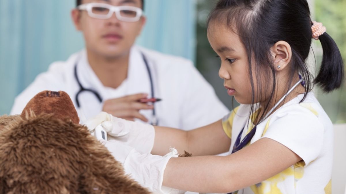 504738333 Girl In Peds Office With Teddy Bear