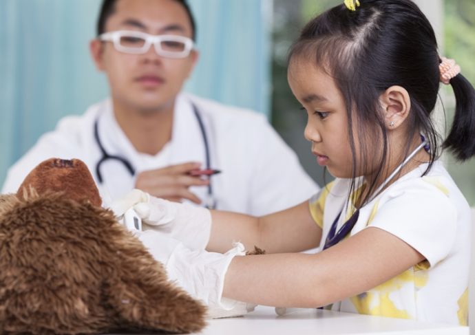 504738333 Girl In Peds Office With Teddy Bear