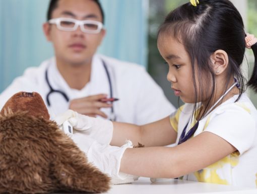 504738333 Girl In Peds Office With Teddy Bear