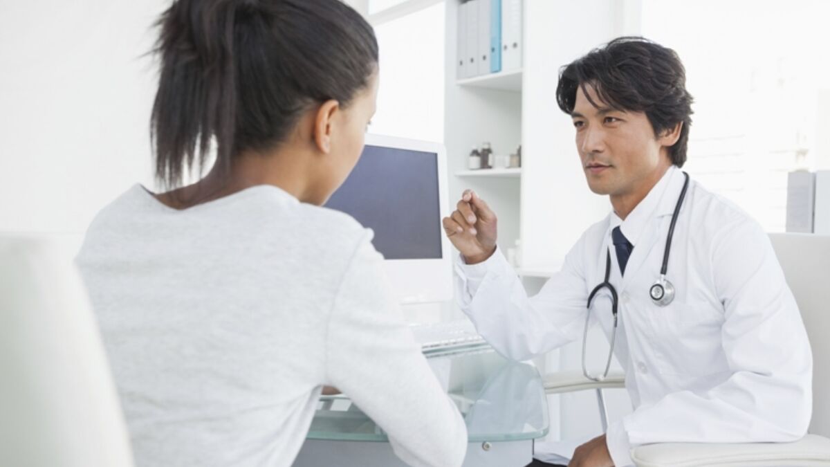 518012381 Doctor Speaking With Female Patient