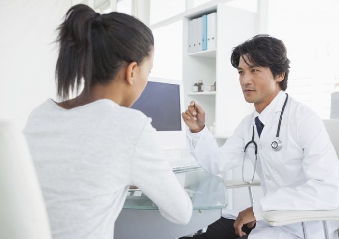 518012381 Doctor Speaking With Female Patient