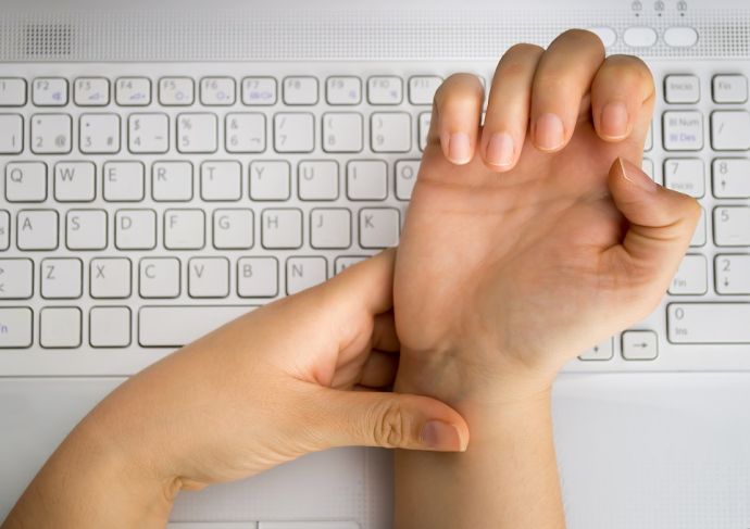 woman clutching her wrist