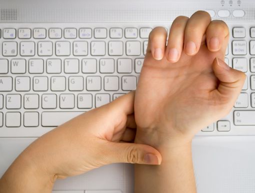 woman clutching her wrist