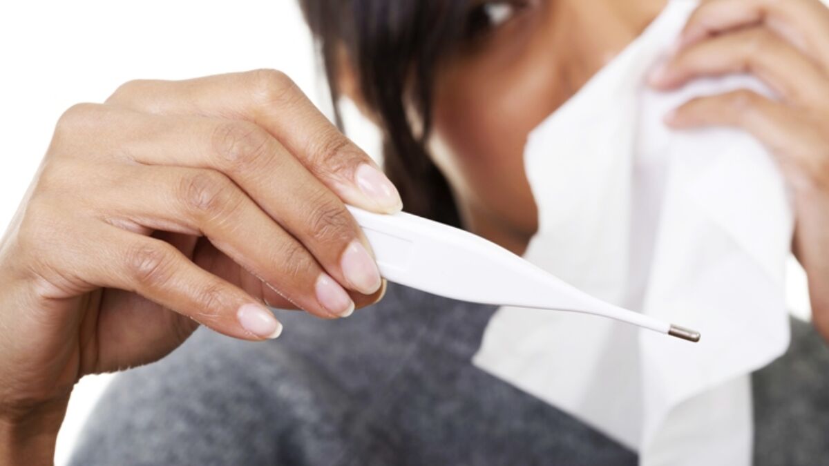 Woman showing thermometer