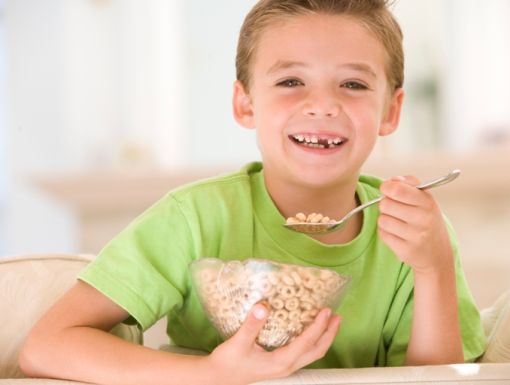 84468409 Boy Eating Cereal