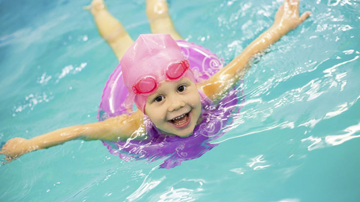 160892303 Little Girl Swimming In Pool