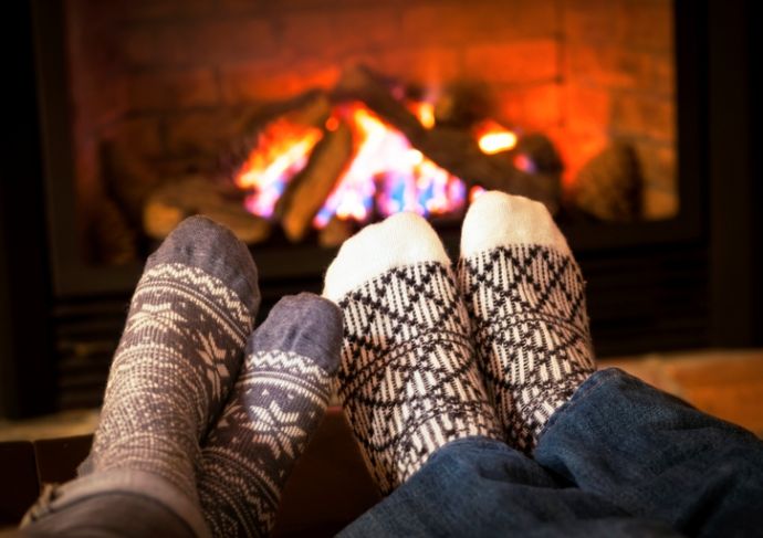 176623353 Feet Warming By Fireplace