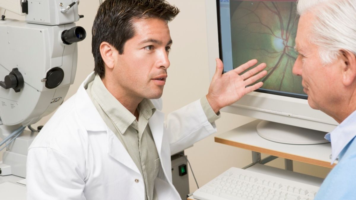 100596209 (1) Doctor Explaining Eye Exam Results To Patient