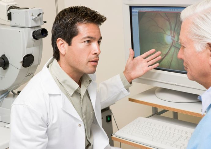 100596209 (1) Doctor Explaining Eye Exam Results To Patient