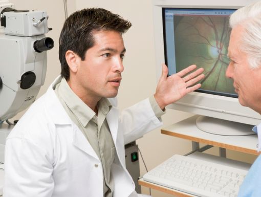 100596209 (1) Doctor Explaining Eye Exam Results To Patient