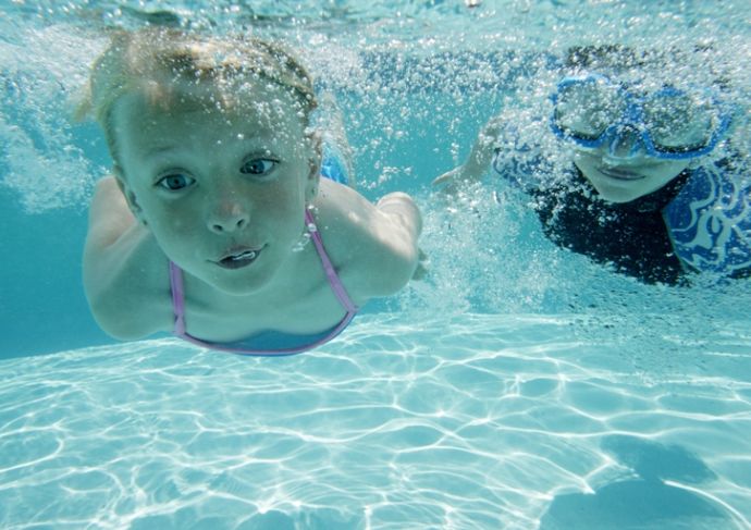 124816944 Boy And Girl Swimming