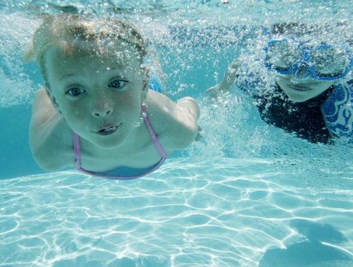 124816944 Boy And Girl Swimming